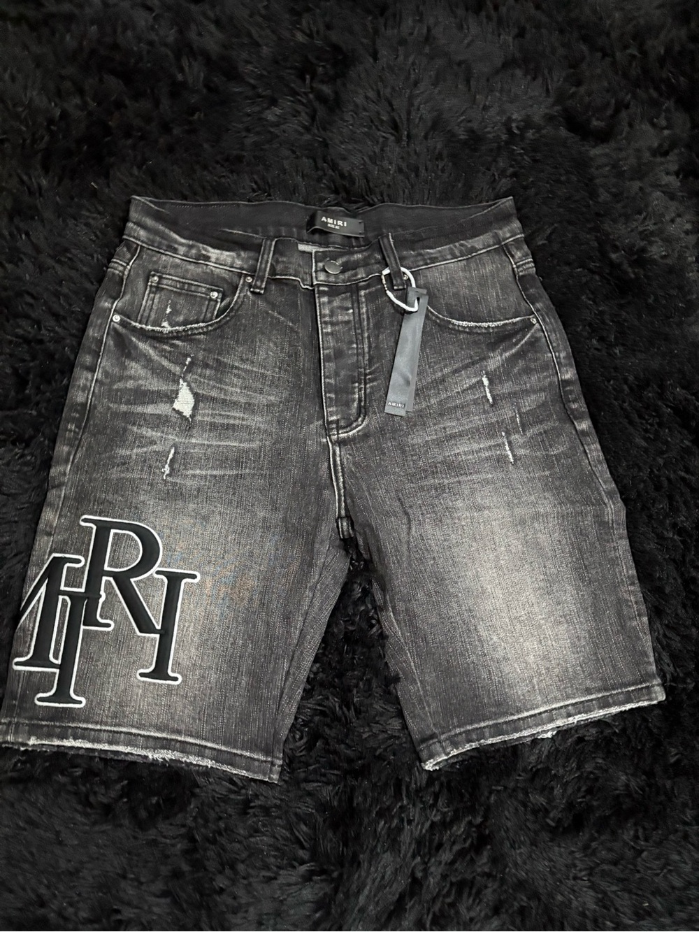 AMIRI Faded Black Distressed Denim Shorts with Logo Patch